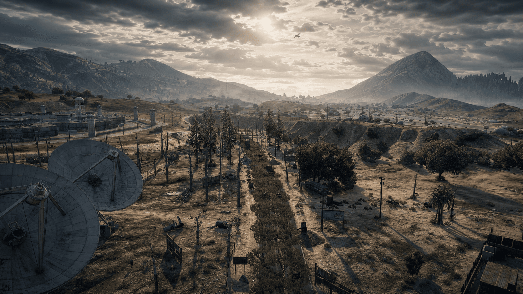 FiveM zombie survival landscape — desert valley, satellite dishes, and prison outpost at dusk